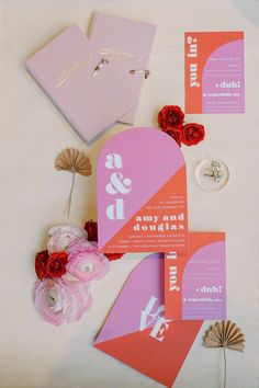 pink and orange wedding stationery with flowers