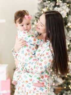 Celebrate the magic of the holiday season with our Family Pajamas. Perfect for creating sweet, lasting memories with your family, these matching pajamas bring a sense of togetherness and festive cheer. Made from our signature ButterSoft fabric, you'll stay cozy and comfortable, whether you're decorating the tree, baking cookies, or enjoying a holiday movie night together. Sizing Model is wearing 6-12M. 0-3M | Chest 17.25", Length 18.75" 3-6M | Chest 19", Length 20.75" 6-12M | Chest 20.5", Length Holiday Movie Night, Adorable Style, Embellished Sweatshirts, Loungewear Dresses, Baking Cookies, Under The Tree, Holiday Pajamas, Holiday Movie, Holiday Sweatshirt