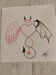 a drawing of a dragon with wings and a heart on it's back, sitting on top of a piece of paper