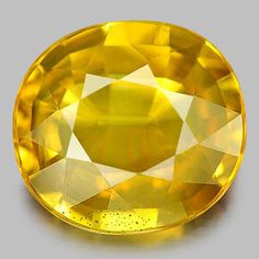 an oval shaped yellow sapphire stone