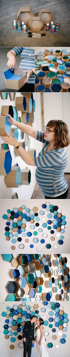 a woman is standing in front of a wall made out of geometric shapes