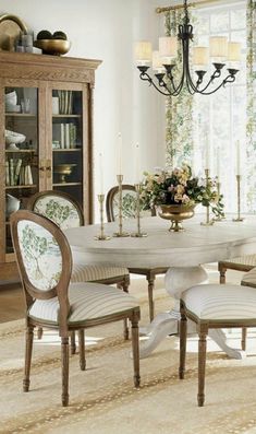 a dining room table with chairs around it