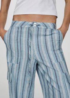 Trousers striped cargo pockets - Woman | MANGO USA Striped Trousers, Cargo Trousers, New Generation, Striped Pants, Stripes Design, Mango, Blue Color, Trousers, Pants