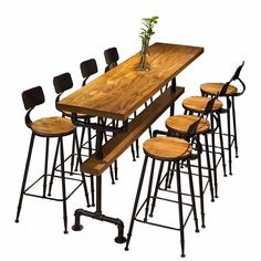 a long table with six stools and a plant on top