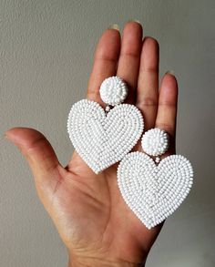 "Handmade white beaded Heart shape embroidered bridal earring Purely handmade seed beads embroidered heart earring looks so great. An ideal gift for bridesmaids and brides. Earrings measure approx. 2.10\" long and 2.10\" wide. Carnation jewellery only sells purely handmade products from India, there may be a slight imperfection due to the nature of work but we try our best to make them look perfect. * The products are made and shipped from India. * It takes 1- 2 day to ship the order from India Brides Earrings, Beaded Heart Earrings, Earring Looks, Jewellery Tutorial, Boho Wedding Earrings, Diy Fabric Jewellery, Bridal Earring, Embroidery Beaded, Beaded Heart