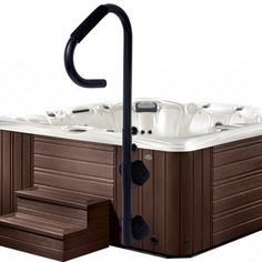 an outdoor hot tub with steps leading up to it and a black handle on the side