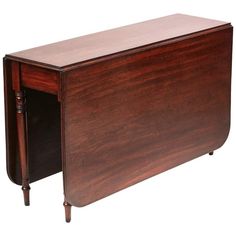 a wooden desk with two drawers on one side and an open drawer on the other