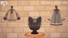 an animated cat sitting on top of a table next to two dress up clothes hanging from the wall