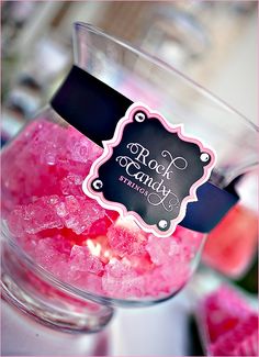 a glass jar filled with pink sugar