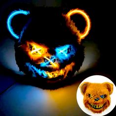 a teddy bear with glowing lights on it's face next to a lit up mask