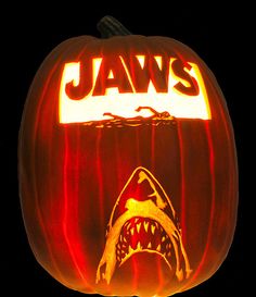 a pumpkin carved to look like a shark with jawss on it