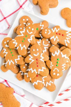 a plate full of ginger cookies with white icing