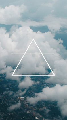 an aerial view of clouds with a triangle in the middle