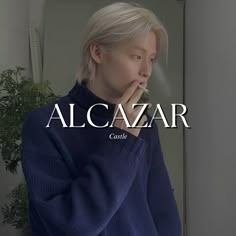 a person standing in front of a mirror with their hand on her mouth and the words alcazar written across it