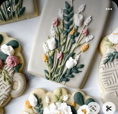 some cookies decorated with flowers are on a table