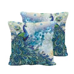 two pillows with blue and green designs on the front, one has a peacock design