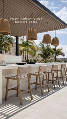 an outdoor dining area with chairs and tables