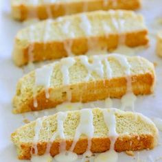 slices of lemon pound cake with icing drizzled over them on a white surface