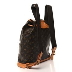 This is an authentic LOUIS VUITTON Monogram Montsouris GM Backpack. This backpack is crafted of classic Louis Vuitton monogram coated canvas. The bag features vachetta leather accents, a leather belt closure, and a front zipper pocket. The top opens to a cocoa brown fabric interior with a patch pocket. Cocoa Brown, Leather Accents, Brown Fabric, Authentic Louis Vuitton, Leather Belt, Front Zipper, Louis Vuitton Monogram, Patch Pocket, Zipper Pocket