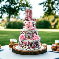 a baby shower cake with pink and brown decorations