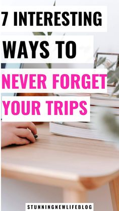 a person sitting at a table with a book and pen in their hand text reads 7 interesting ways to never forget your trips