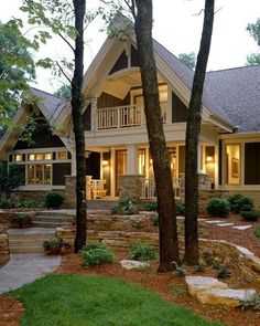 a large house with stone steps leading to it