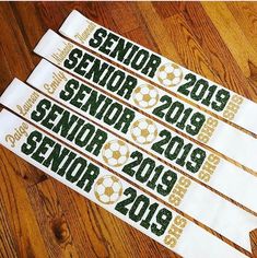 four white and green ribbons with the words senior, senior, senior 2013 - 2019 on them