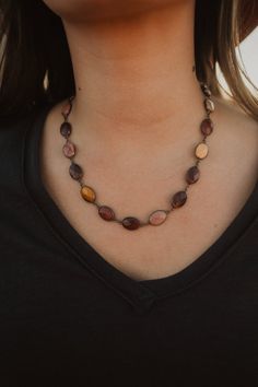 The coloring in each stone is breathtaking! Gun metal chain Purple and warm colored hues in stones Faceted, oval shape stones Big clasp Chain measures about 16 inches with 2 inch extender Bridgerton Necklace, Metal Chain, Oval Shape, Chain, Stone, Purple, Color