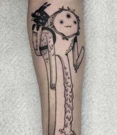 a person with a tattoo on their leg that has an image of a man holding a snake