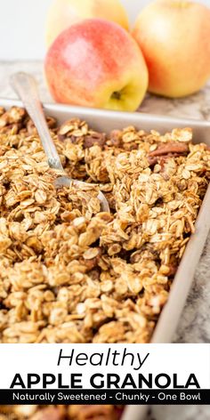 healthy apple granola in a pan with two apples behind it