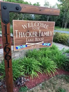 a welcome sign to the thacker family lake house