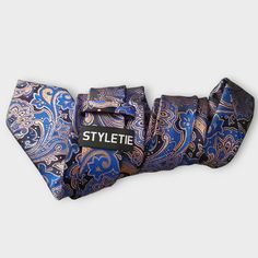 Treat yourself with a new pattern and splash of color to your look with this unique tie set. 100% Silk Handmade Package Includes: Tie, Pocket Square & Cufflinks. Length: 59" Width: 3.34" Warm iron if needed Blue Standard Tie For Father's Day, Dapper Blue Tie Suitable For Gift, Dapper Blue Tie For Gift, Dapper Blue Tie As Gift, Dapper Adjustable Blue Ties, Blue Tie For Father's Day Party, Adjustable Blue Ties For Formal Occasions, Adjustable Blue Ties For Father's Day, Blue Adjustable Suit And Tie Accessories For Formal Occasions