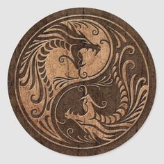 the yin yang symbol is carved into wood