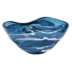 a blue glass bowl sitting on top of a white table