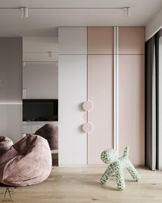 a living room with a bean bag chair and a stuffed animal in front of the window