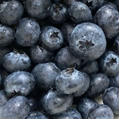 blueberries are piled on top of each other