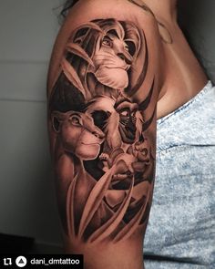 a woman's arm with an image of the lion and other animals on it