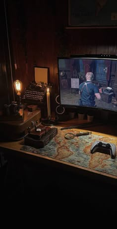 a desk with a computer monitor, keyboard and mouse on it in front of a map