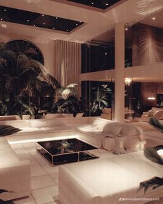 a living room filled with lots of white furniture