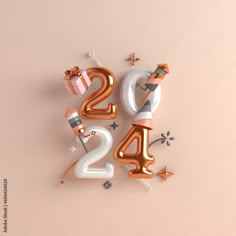 the number twenty four is made up of balloons and presents in gold, white and silver