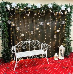 a white bench sitting in front of a christmas backdrop