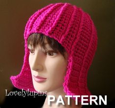 a mannequin head wearing a pink crochet hat