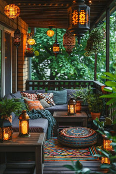 an outdoor porch with lanterns and pillows on it