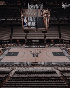 an empty basketball court with the logo of the san antonio spurs on it's side