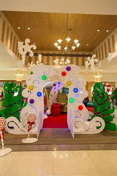 an entrance decorated with christmas decorations and candy canes