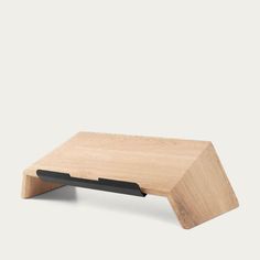 a small wooden table with black legs