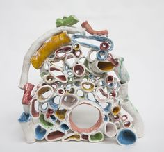 a ceramic sculpture made to look like it has many different colors and shapes on it