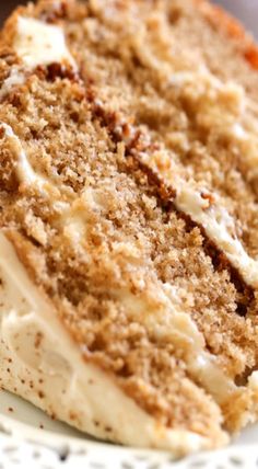 a slice of carrot cake on a white plate