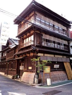 an old wooden building with balconies on the second floor