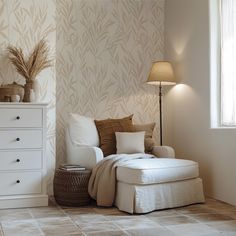 a living room scene with focus on the chaise - lounge chair and floor lamp